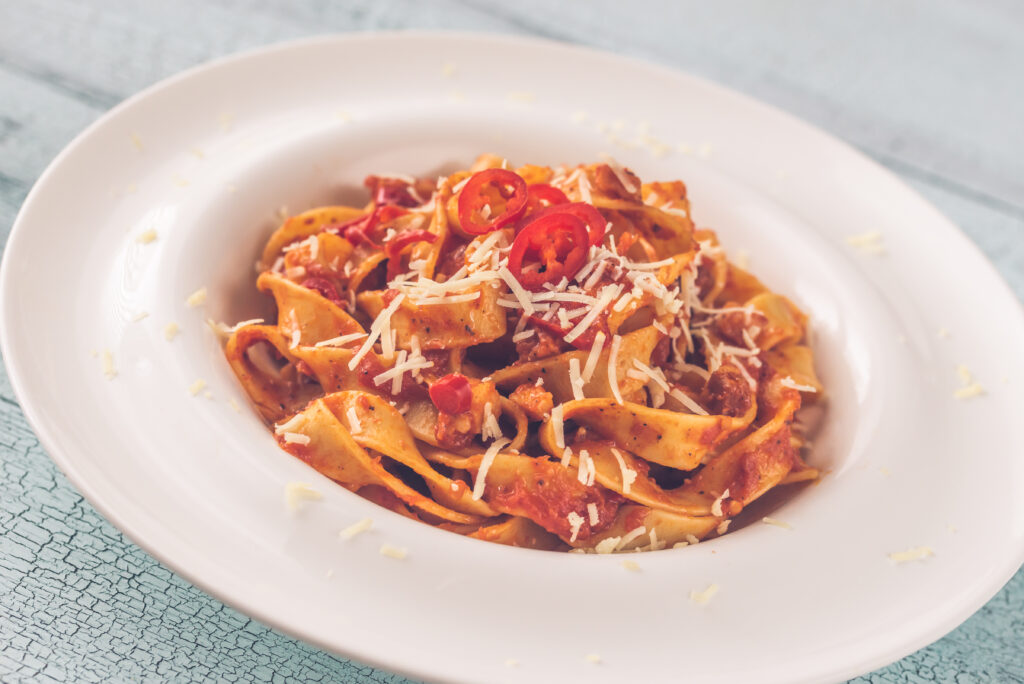 Traditional Amatriciana pasta with tomato sauce, guanciale and Pecorino Romano cheese