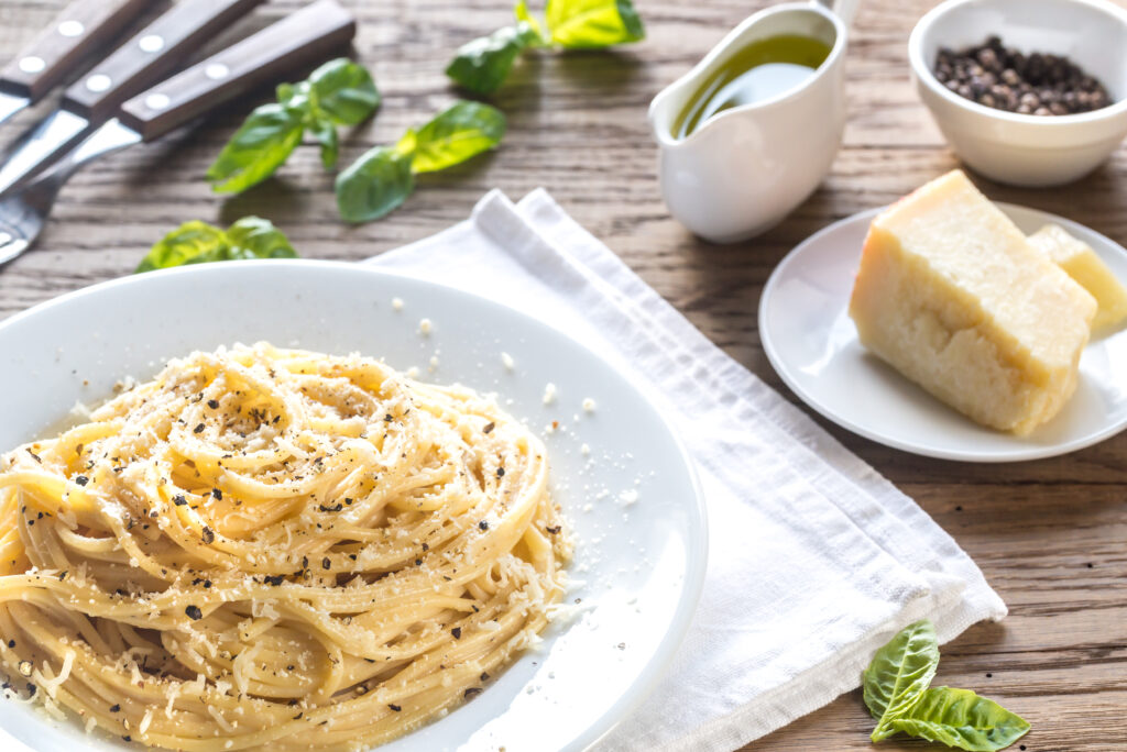 Traditional Roman Cacio e Pepe pasta made with Pecorino Romano cheese and black pepper