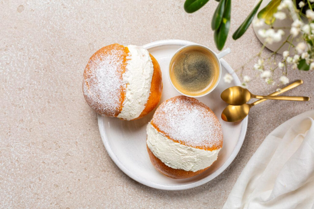 Traditional Maritozzo sweet bun filled with fresh whipped cream in Rome