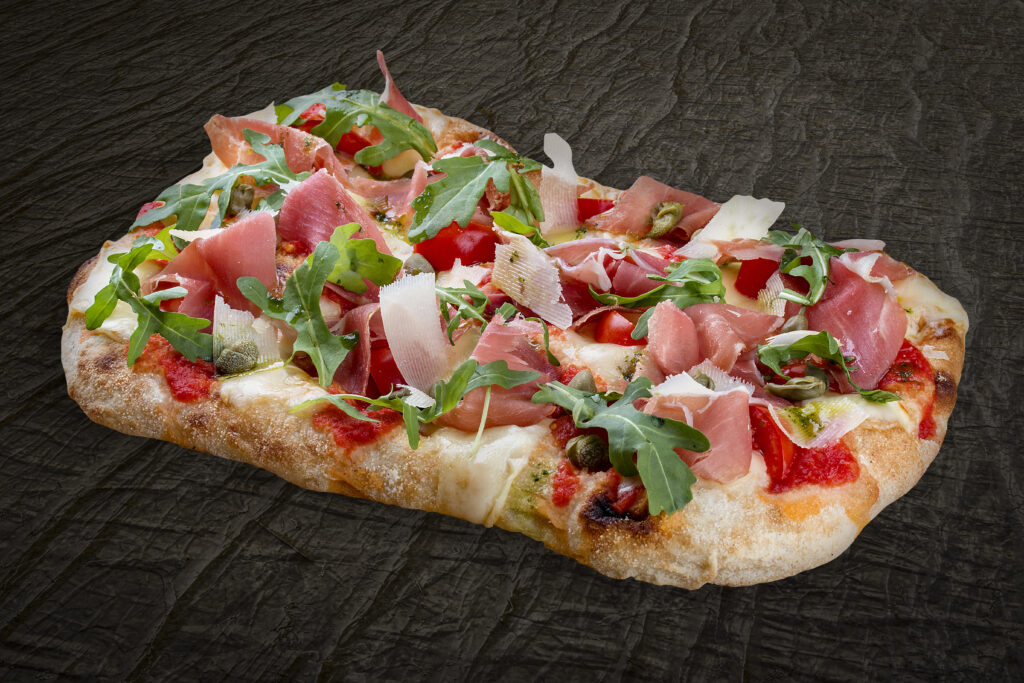 Pizza al Taglio street food pizza slices sold by weight in Rome Italy